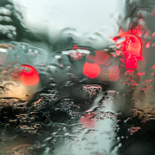 rainy car window in traffic
