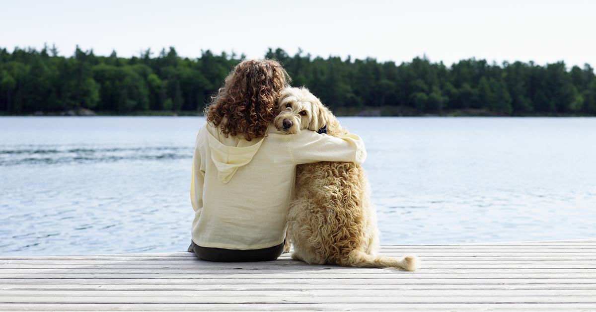 Dog and woman on dock