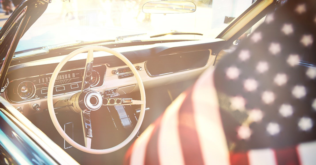 American flag and car
