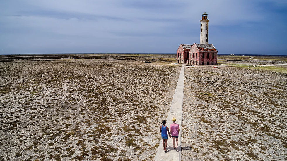 Couple Walking up to old lighthouse at Klein Curacao