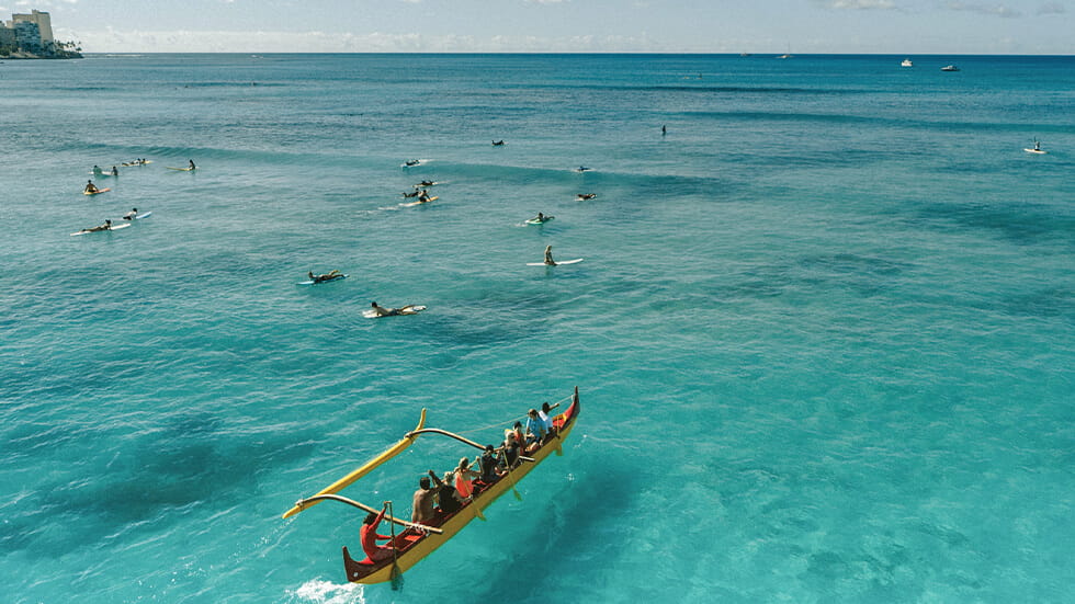 Families can try paddling an outrigger canoe, one of Hawaii's local cultural traditions. Photo courtesy of Hawaii Tourism