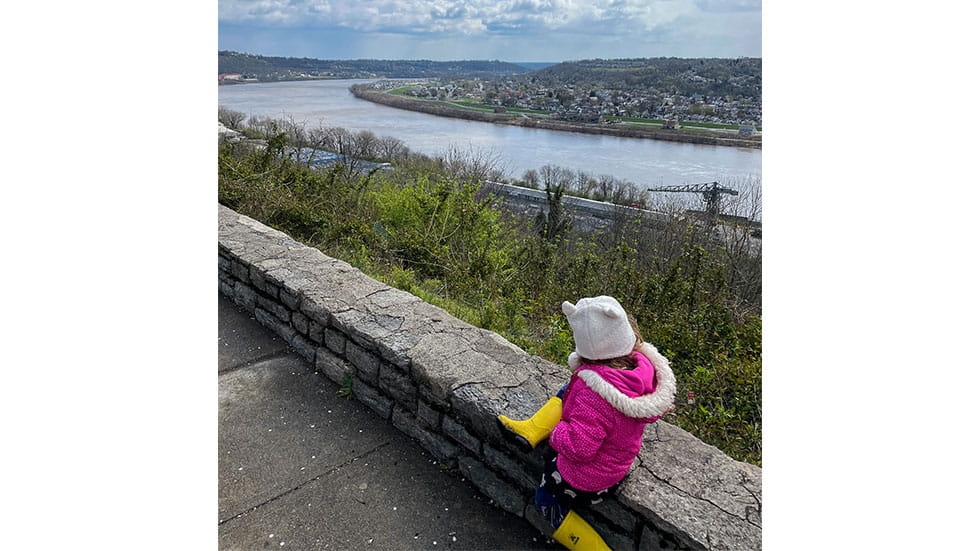 Taleghani's daughter Sophie explores a park overlooking the Ohio River on a recent trip.